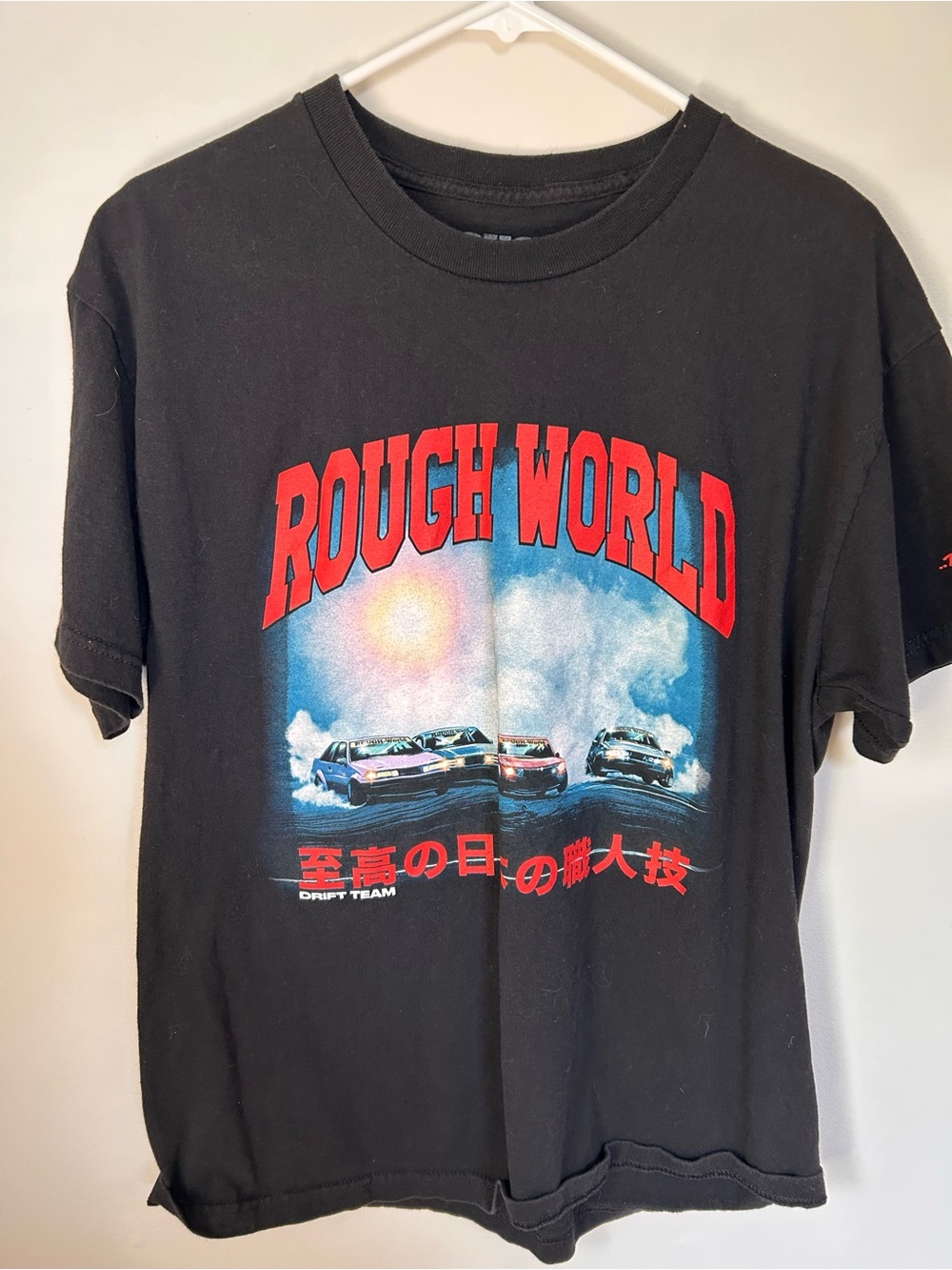 Rough World Graphic Tee in Black with Red & Blue Design